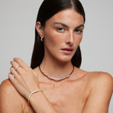 Bracciale rigido in argento dorato con zirconi bianchi