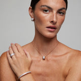 Orecchini bullone in argento rosato con zirconi bianchi